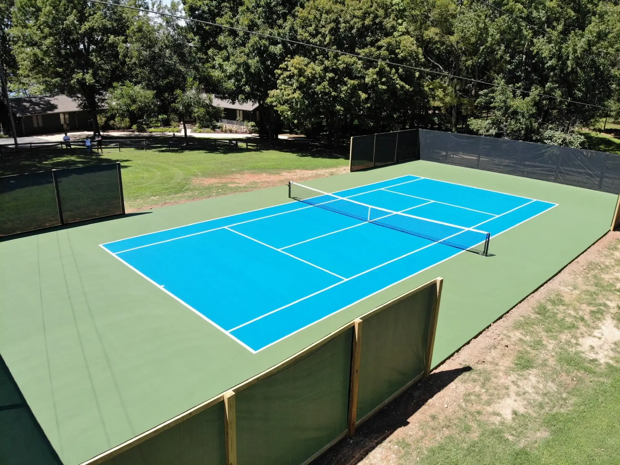 Private residential tennis court with fresh surface